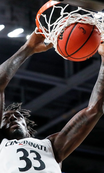 Scott, Brooks help Cincinnati pull away from Milwaukee 74-63
